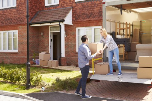 Team member safely loading furniture into a van
