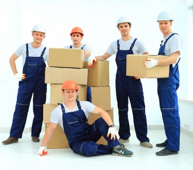 Business and household items being unloaded from a removals van