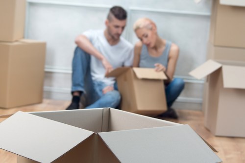 Packed boxes and furniture ready for a local move in North Kensington