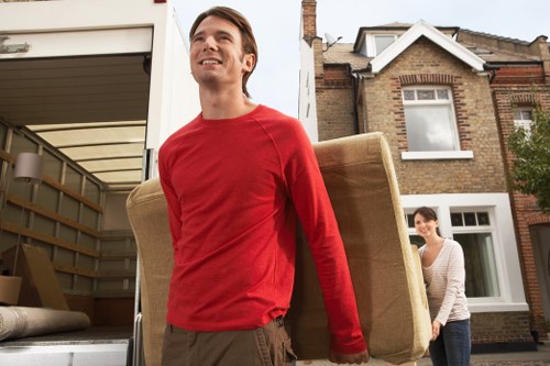 Local office moving crew handling equipment in West London