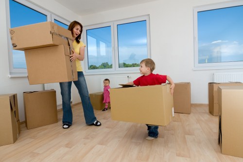 Loading furniture into a van on a North Kensington residential street