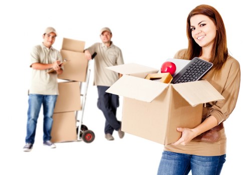Removal team loading furniture in a North Kensington property move