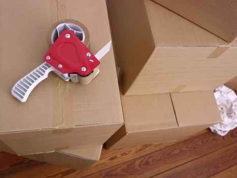 Packed office boxes and furniture ready for transport