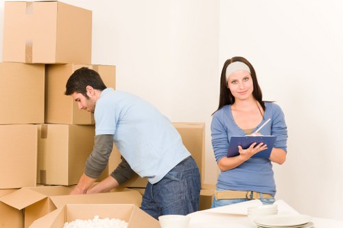 Trained removal staff handling boxes carefully