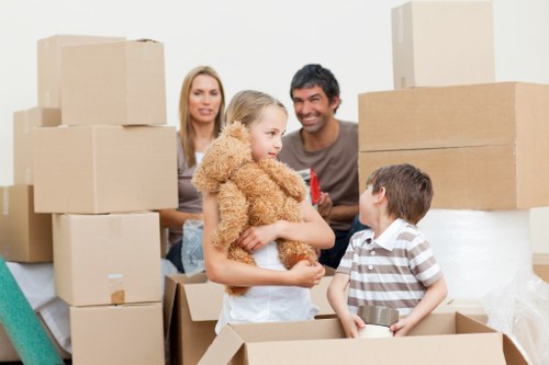 Packed boxes and furniture ready for collection in North Kensington